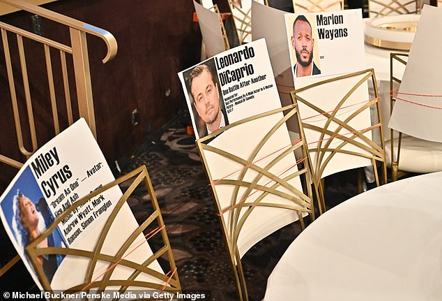 Once the Titanic alum is safely inside the Beverly Hilton Hotel, he'll be seated next to Marlon Wayans and Miley Cyrus, which could get awkward