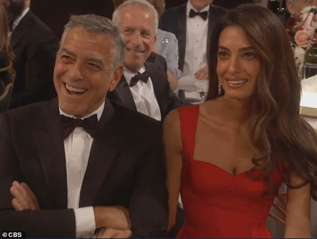 While Clooney took the the jokes in stride, his wife Amal Clooney looked stunned and only cracked a shy smile as Glaser continued ripping into the Oscar-winner