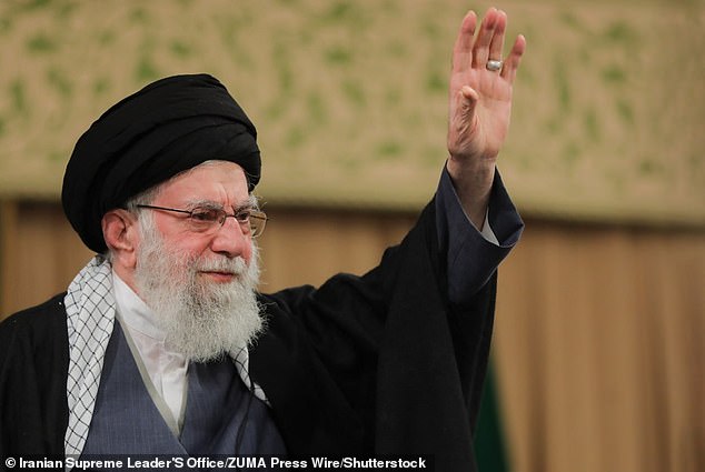 Iranian Supreme Leader Ali Khameni waves during a gathering of the people of Qom in Tehran on January 9, 2026