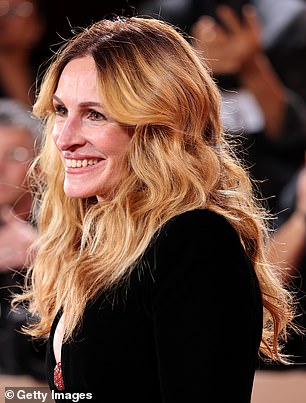 She brought a little 1980s flair to the look as the dress featured shoulder pads and she donned a pair of heels