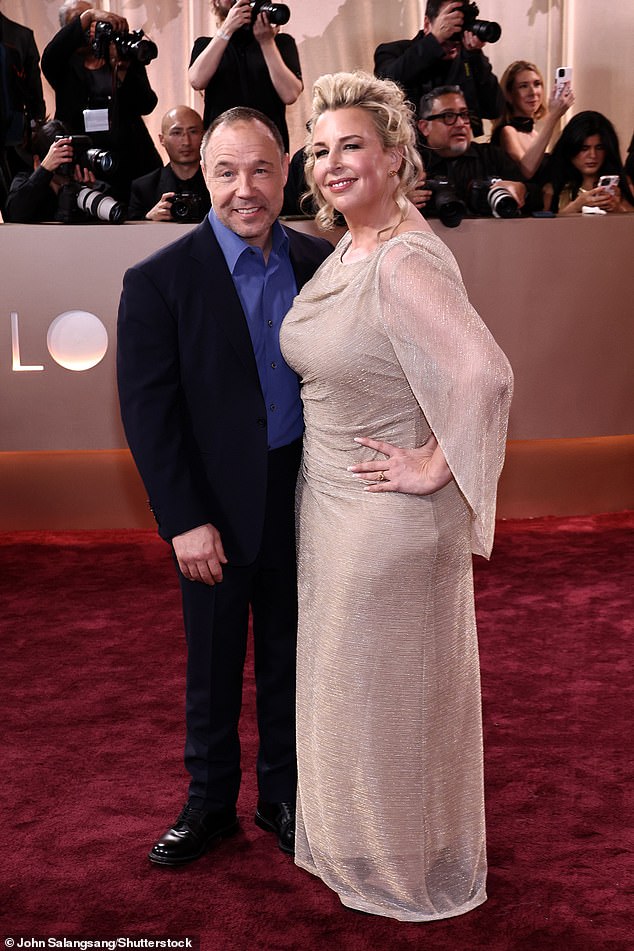 Meanwhile Stephen opted for a smart black suit and a blue shirt for the occasion