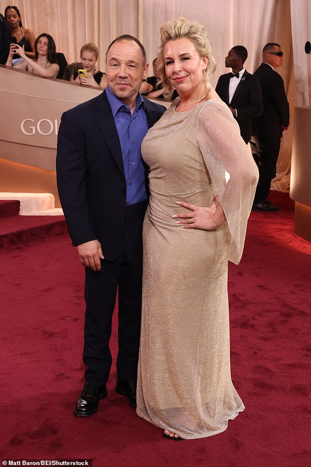 The English actor couldn't wipe the smile off his face as he took to the awards' red carpet with his beloved wife and fellow actress