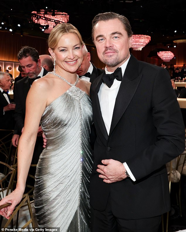 He cozied up to a very glam Kate Hudson