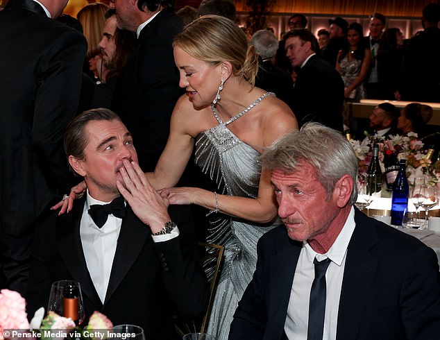 Leonardo DiCaprio was seated next to his One Battle After Another castmate Sean Penn when he was seemingly startled by Kate Hudson