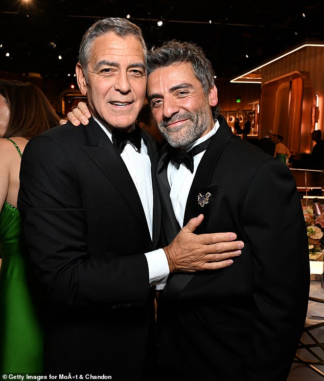 Clooney and Frankenstein star Oscar Isaac posed for a picture together inside the venue