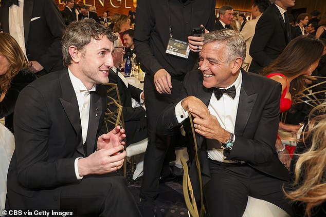 Mescal and Clooney scooted their chairs together in order to have a quick conversation inside the packed room