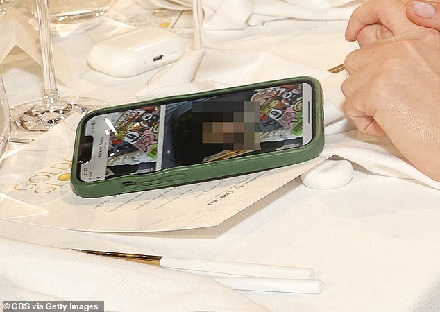 Eagle-eyed fans will note the image which had flashed up on her iPhone screen, which appeared to be of her baby daughter