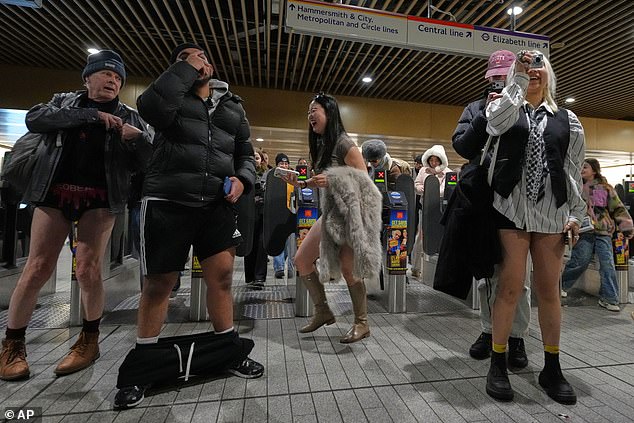 Passengers travel on the Underground during the annual No Trousers Tube Ride yesterday