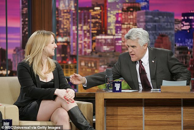 The star looked darling in her black minidress and boots when talking to Jay Leno