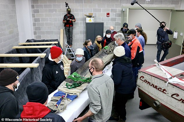 Archeologists have pulled two of the 16 canoes from the lake and are working on preserving them for a future museum exhibition