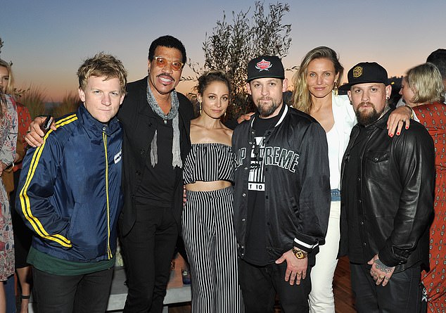 Richie is pictured with father Lionel Richie, Madden, his twin brother Benji, his wife Cameron Diaz and the rockers' brother Josh in 2016