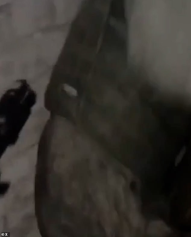 The Russian soldier can be seen holding a gun towards the mercenary before describing him as a 'bottle opener'