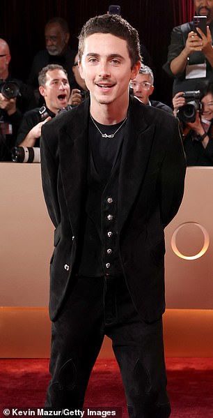 The couple did not walk the red carpet together, with Chalamet opting to brave the event's photographers alone in an all-black outfit