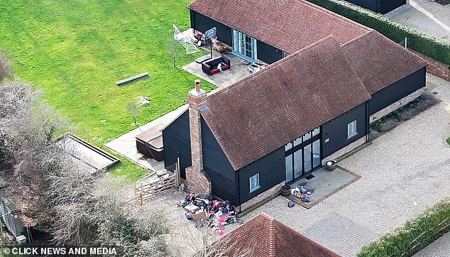 By comparison the neighbouring homes look neatly looked after