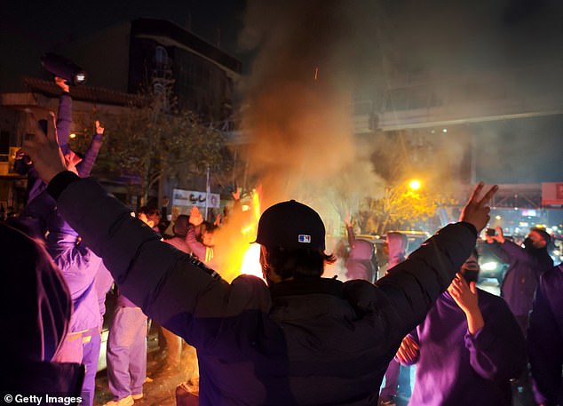 Fires are lit as protesters rally on January 8, 2026 in Tehran, Iran