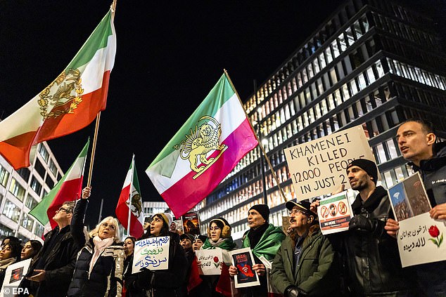 Protesters attend a rally in support of the nationwide mass demonstrations in Iran against the government, in Zuerich, Switzerland, 13 January 2026