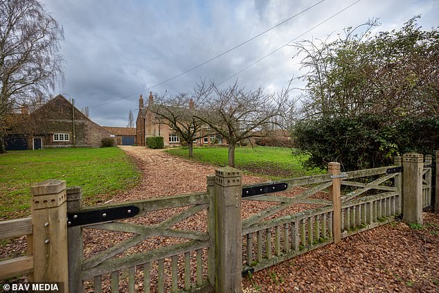 Workers have started renovating inside the run-down Marsh Farm at Sandringham (pictured), while six-foot wooden fences have erected around the home to make it secure and private