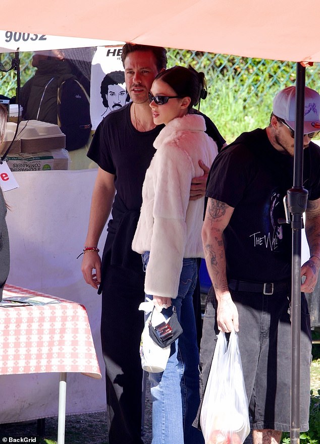 They were joined by Nicola's brother Bradley who threw his arm around his sister