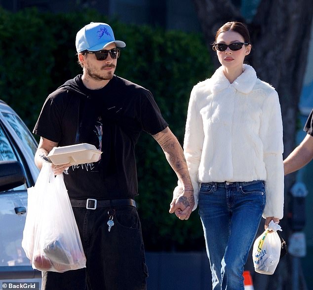 He shieled himself from the sun with black sunglasses and a Cloud9 baseball cap