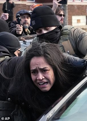 She appeared distressed as she was pulled from her vehicle