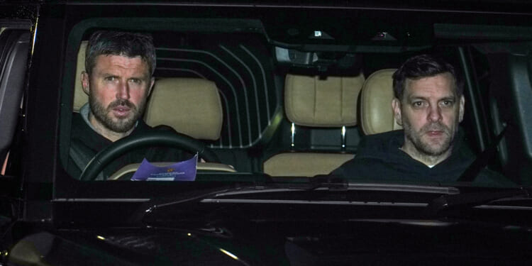 Michael Carrick gives Jonathan Woodgate a lift to training as he prepares for Man Utd baptism of fire against City