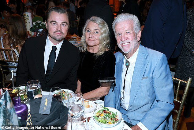 He added: 'Driving me to auditions every single day after school. Supporting the dream that started in the theatres… This moment only exists because of you' (Leonardo pictured with his mother and her partner David Ward at the gala)