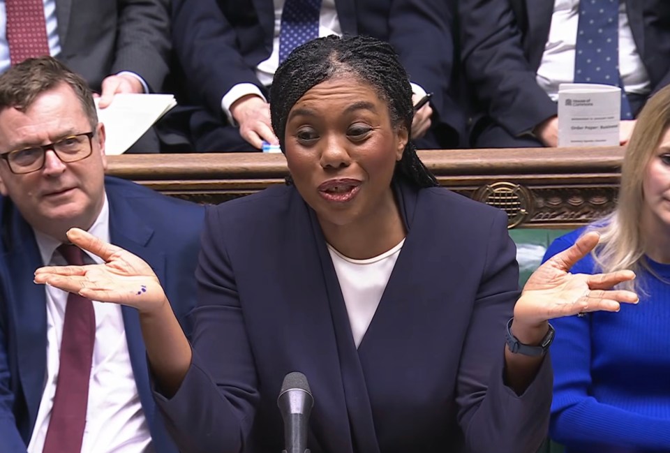 Kemi Badenoch gesturing with her hands while speaking at Parliament.
