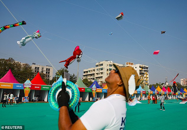 Kite enthusiasts fly kites during the International Kite Festival in Ahmedabad, India, January 13, 2026