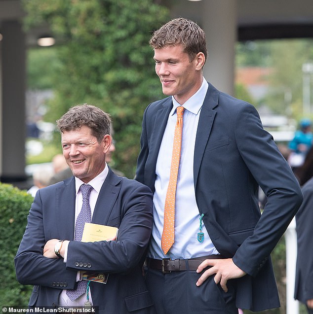 Jonno looms over his horseracing trainer father Andrew as they attend Ascot in July 2025