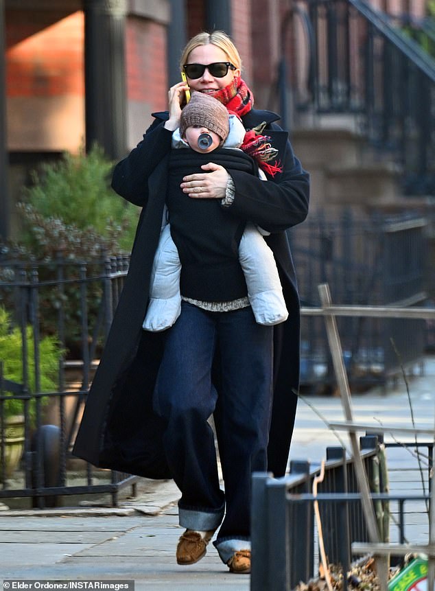 The actress, 45, who won a Golden Globe last week, looked in good spirits as she stepped out for a walk in New York City carrying her baby