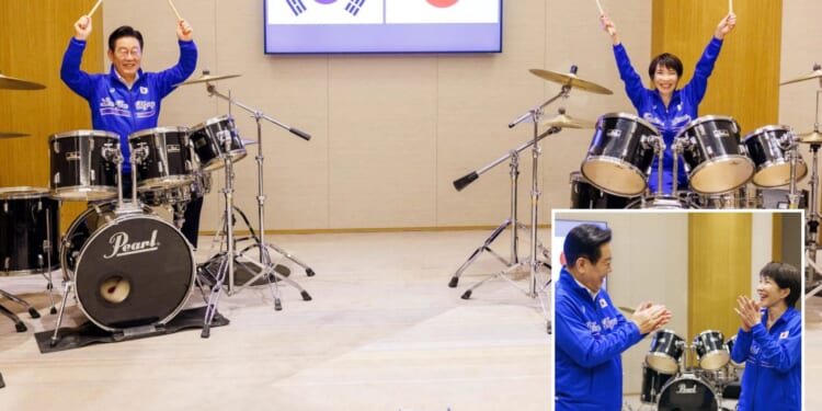 Watch heavy-metal loving 'Japanese Thatcher' PM play on DRUMS with South Korean counterpart…before calling snap election