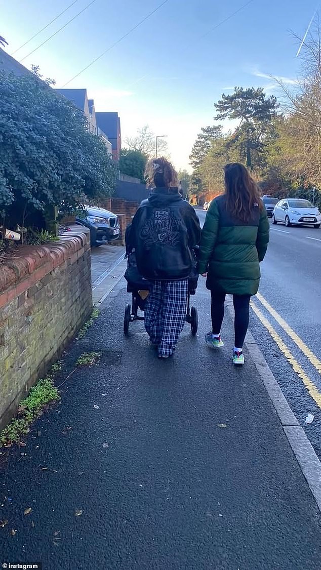 Another snap taken from behind showed Jesy sporting a casual look as she pushed the girls whilst appearing to talk to a pal