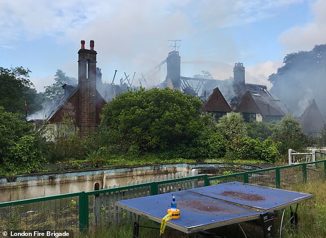 A worse-for-wear shot of the pop star's former home with the roof reduced to a burnt out skeleton