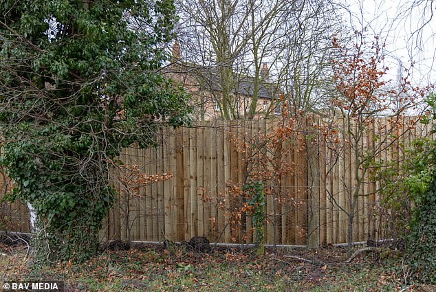 The wooden panelling replaces the flimsy wire that stood before and allowed a good view from the road