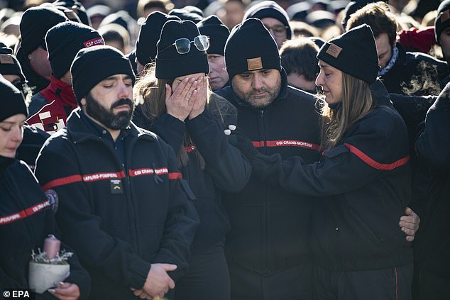 The firefighters of Crans-Montana, the first responders in the fire at the 'Le Constellation' bar and lounge, show emotions as they gather around flowers and candles to commemorate the victims, in Crans-Montana, Switzerland, 04 January 2026