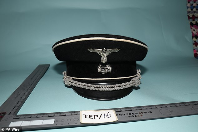 Pictured: The Nazi SS officer's cap that was found in the room and shown to the court