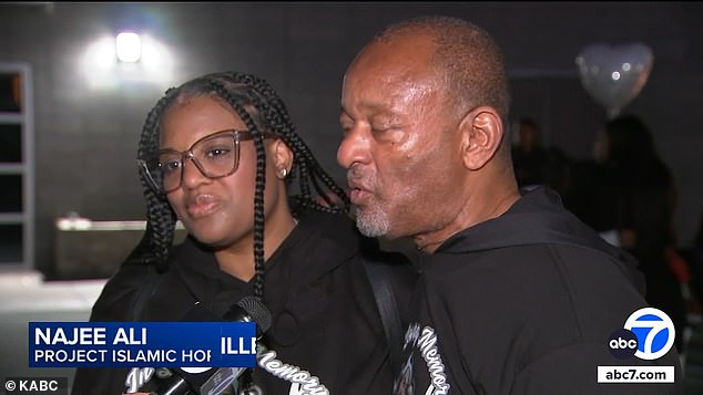 At the vigil, a supporter of the family, civil rights activist Najee Ali (right, seen with Porter Jr's sister) said he acknowledged he was breaking the law by firing his weapon, but said 'at the end of the day it's an American tradition'