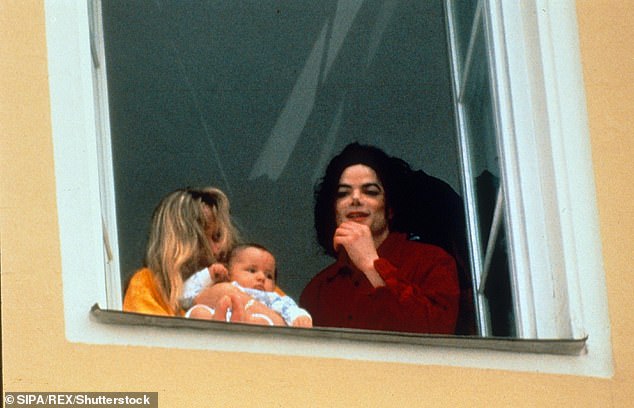 But there have long been rumours that the singer may not be the biological father of any of his three children (Michael and Debbie pictured with their son Prince in 1997)
