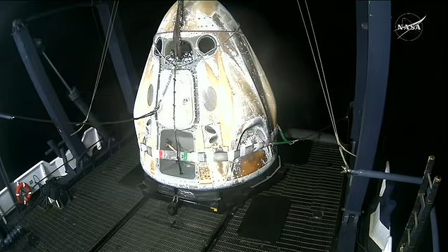 The return capsule was hoisted onto a recover vessel that was waiting nearby in the Pacific Ocean