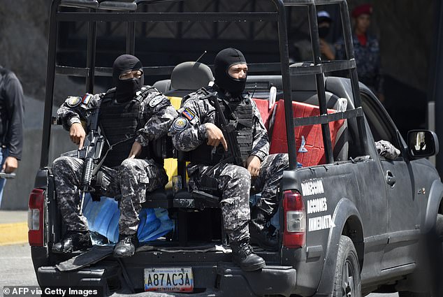 Security forces are seen at the entrance of El Helicoide, the headquarters of the Bolivarian National Intelligence Service (SEBIN), in Caracas, on May 17, 2018