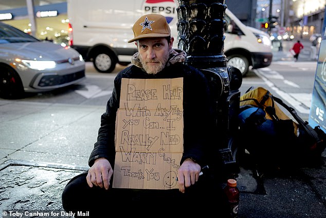 Sean Burke, 43, sat on the pavement with a sign begging for cash not far from McDonald's