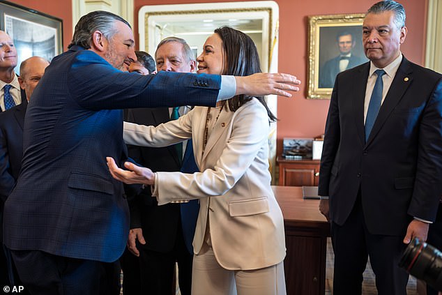 Maria Corina Machado (center) embraces Republican Senator Ted Cruz (left) during a meeting with a bipartisan group of U.S. senators on Capitol Hill Thursday. California Democratic Senator Alex Padilla (right) also attended the meeting