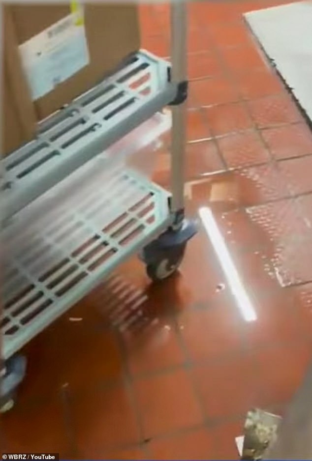Video footage taken after a recent storm revealed rainwater from outside pooling across the red floors and forming deep puddles that ran beneath the all of the kitchen equipment