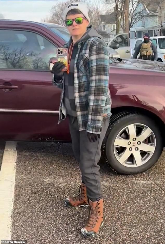 About 20 seconds after Good pulled up to the street, a passenger - believed to be her wife Rebecca (pictured) - exited the vehicle and eventually began filming