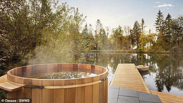 The hot tub looks out to the private lake with stunning views