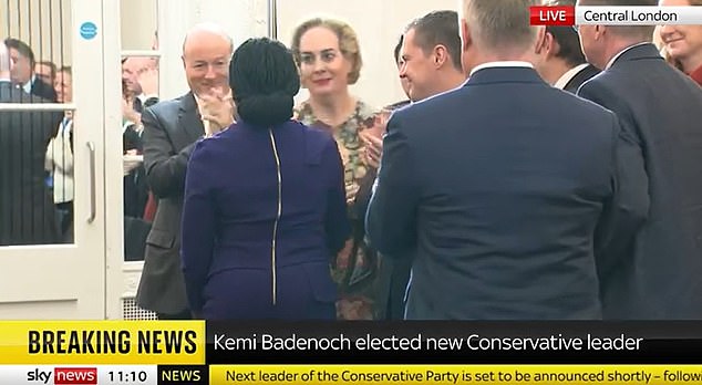 She then congratulated the party leader with a somewhat rictus grin as Mrs Badenoch made her way to the stage to give her first speech as leader.