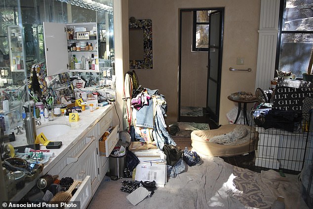 New photos inside the compound show that the home was remodeled and in decent shape even if it was cluttered with clothing, boxes, diapers and dog cages, seen right