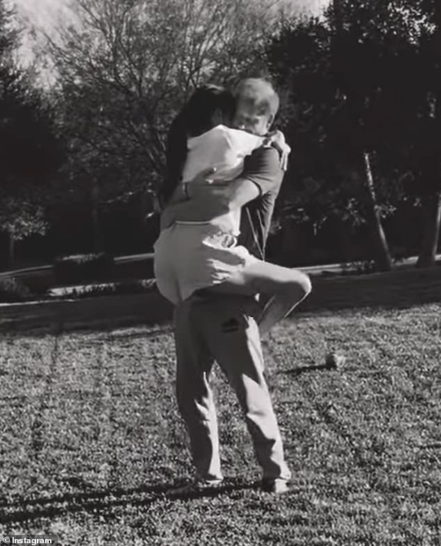 The couple were seen spinning and swaying together before Meghan jumped into Harry's arms