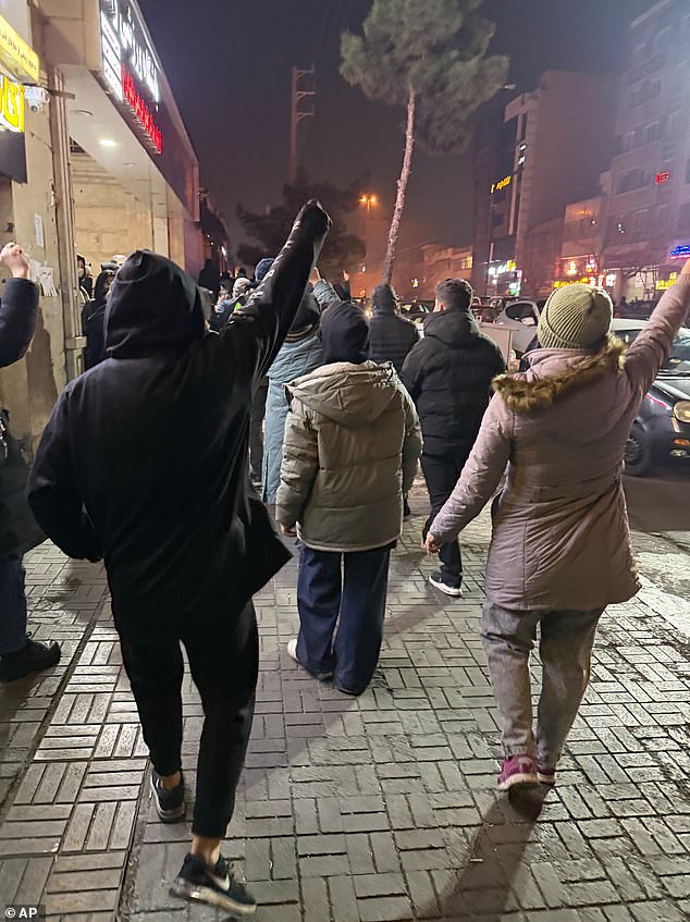 Protesters chant slogans during an anti-government protest in Tehran