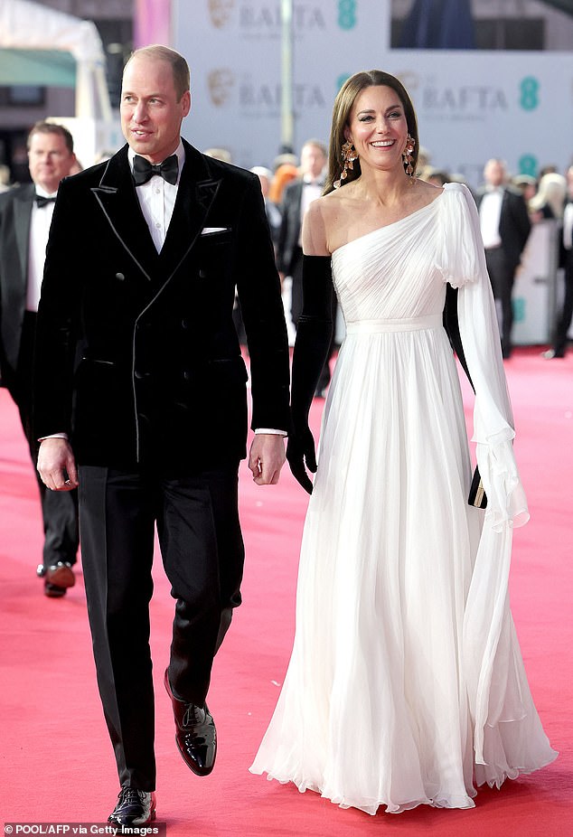 For the star-studded 2023 Baftas, Kate donned a glamorous white Alexander McQueen one-shoulder gown with black gloves. Meanwhile, William, Ms James noted, was 'dressed to kill' in a black velvet double-breasted jacket